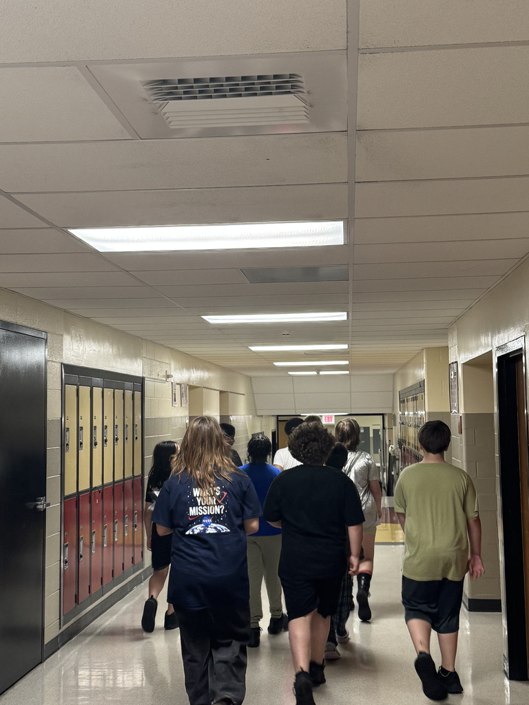 Students walking down a hallway 