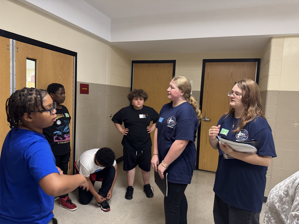 Students talking in a hallway
