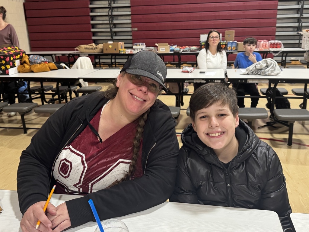 student and parent smiling sitting together