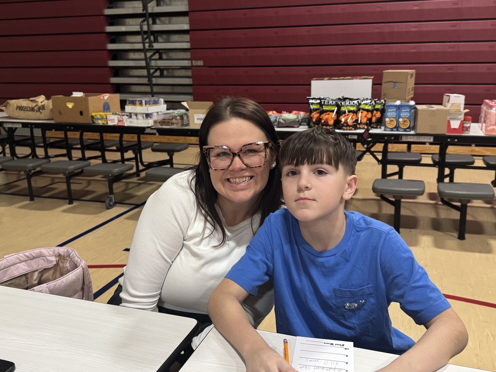 student and parent smiling sitting together