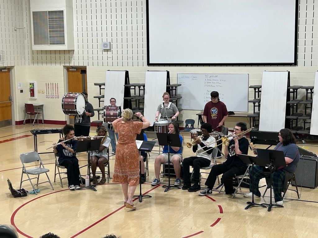 band members playing in a school gym