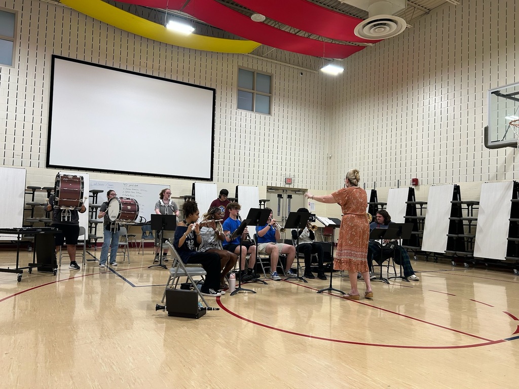 band members playing in a school gym