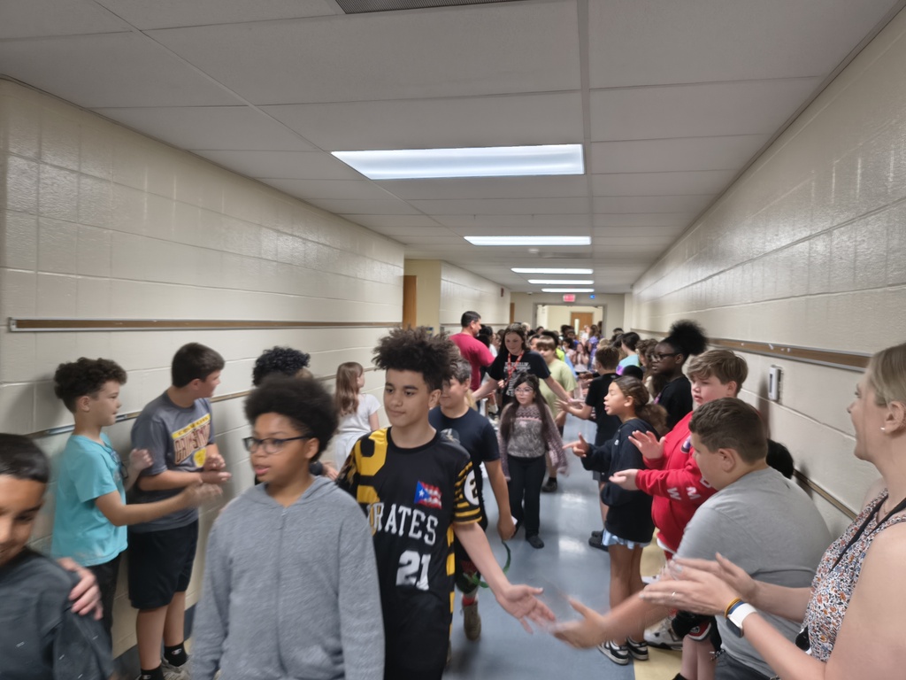 Students waljking the halls clapping