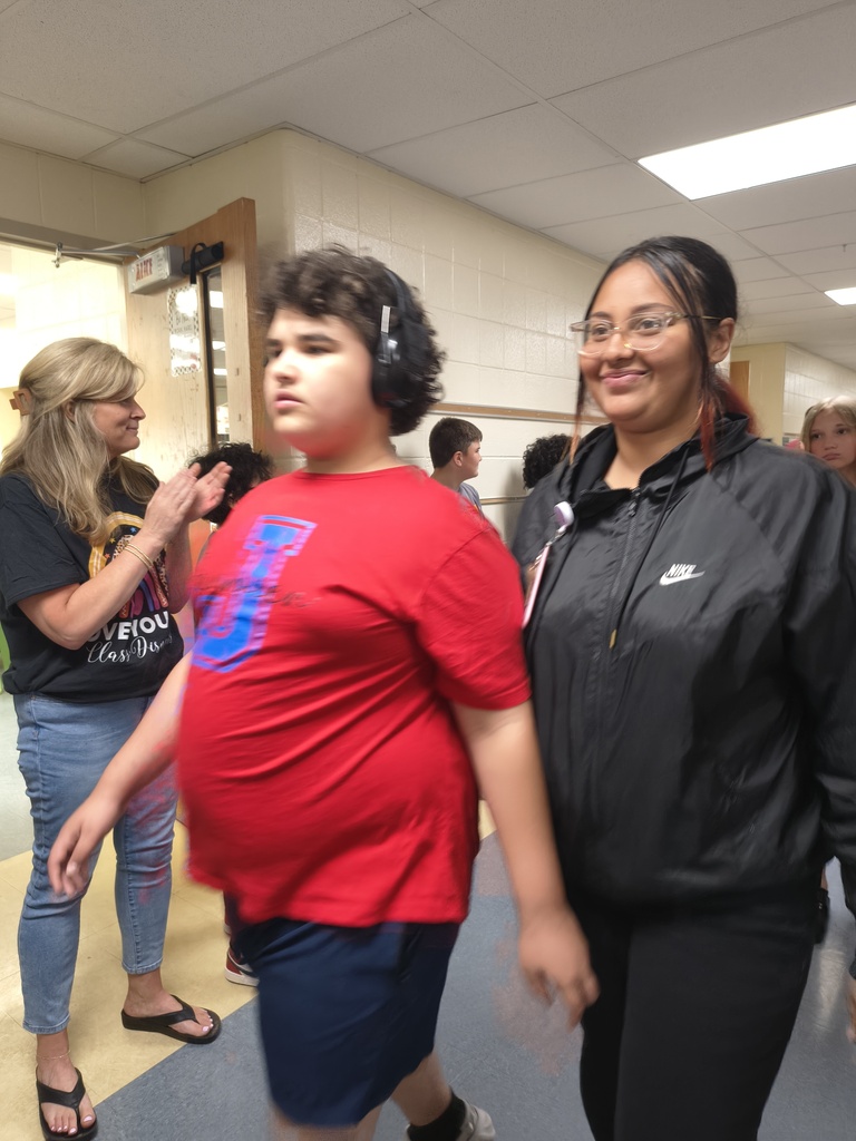 Students waljking the halls clapping