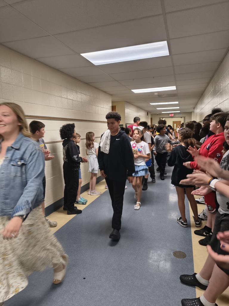 Students waljking the halls clapping