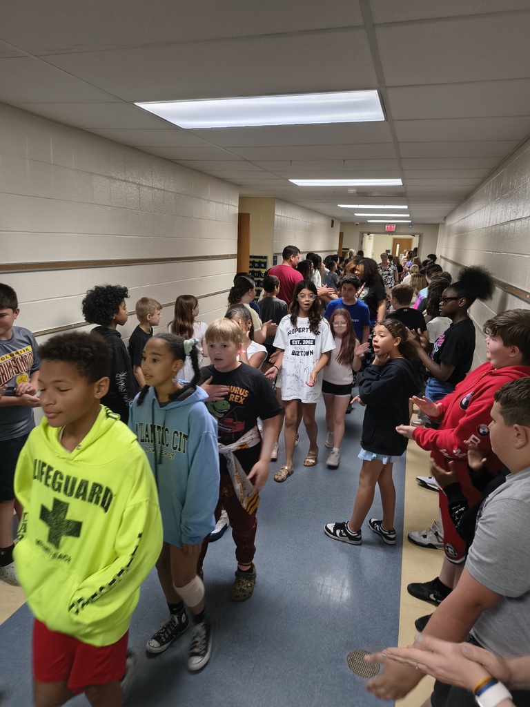 Students waljking the halls clapping