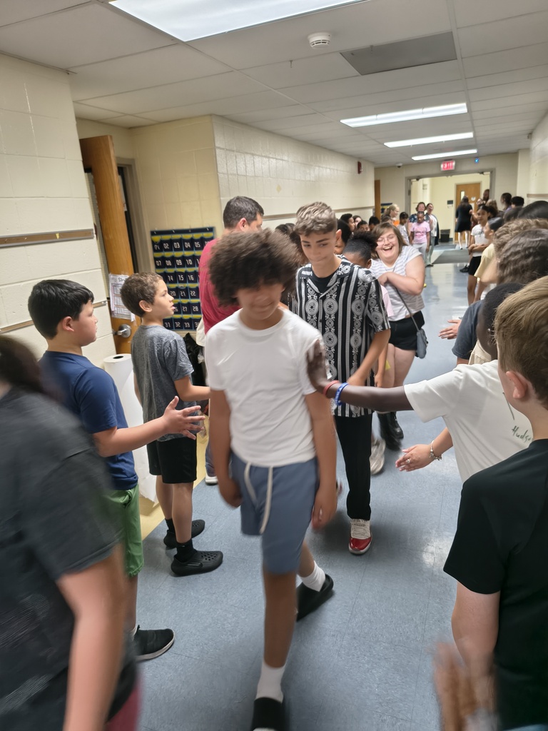 Students waljking the halls clapping