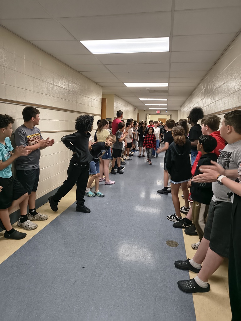 Students waljking the halls clapping