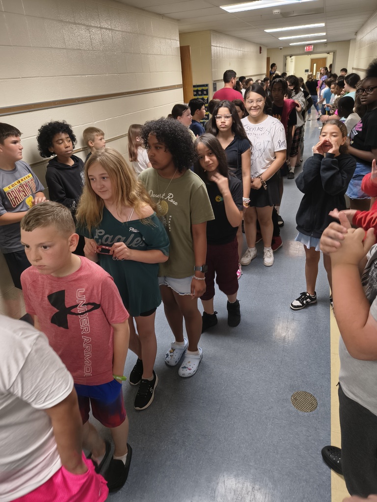Students waljking the halls clapping