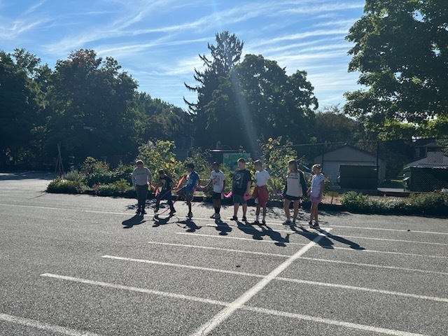 kids outside standing in a line