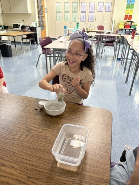 kids washing hands in bowl