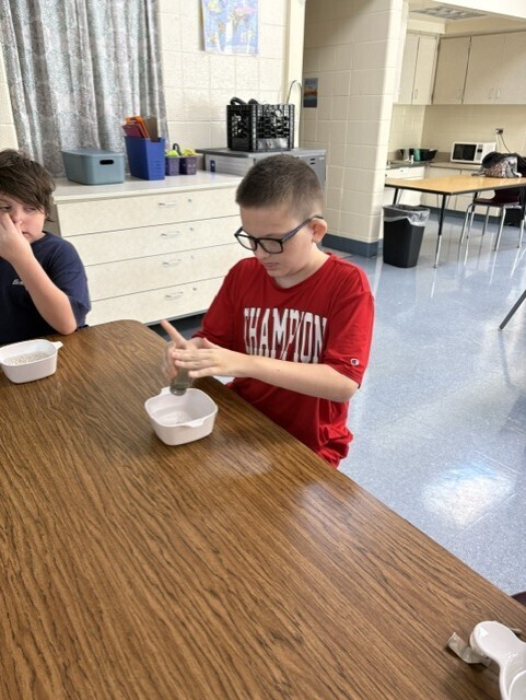 kids washing hands in bowl