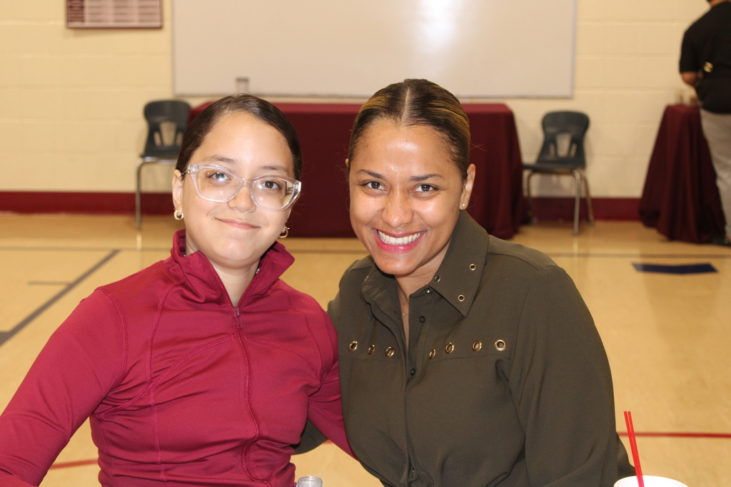 parent and student smiling together