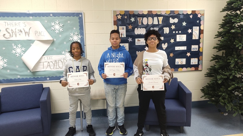 3 students showing their certificates