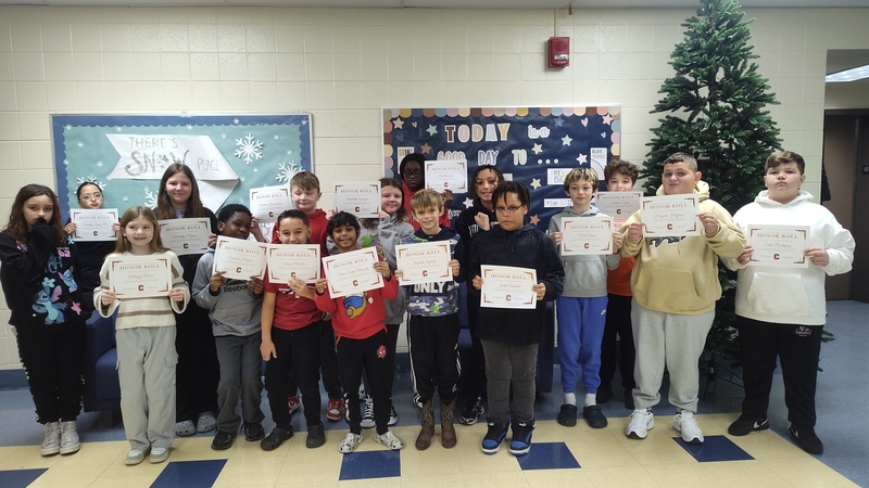 a group of students holding their certificates