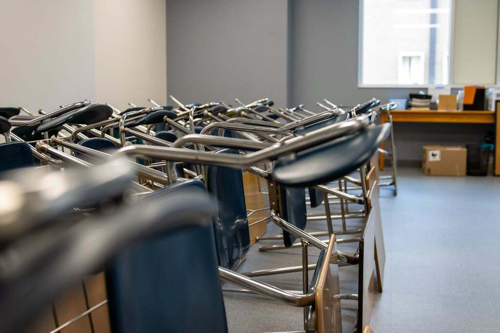 group of desk chairs stacked on top of each other