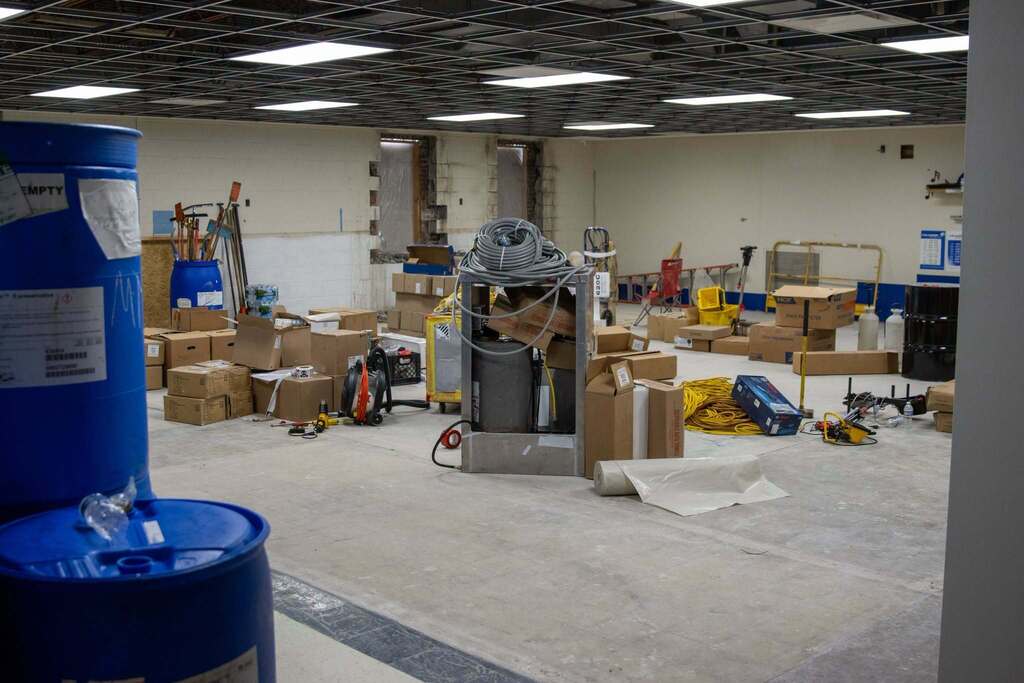 boxes and equipment on the floor in a large room