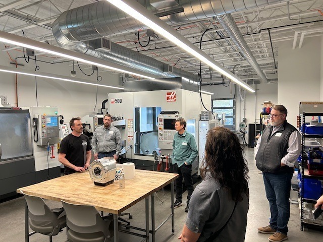 CGCC’s Lead Advanced Manufacturing Instructor, Robert Clark, guides educators and industry partners through the college’s advanced manufacturing lab, showcasing hands-on training that connects students to high-demand careers.