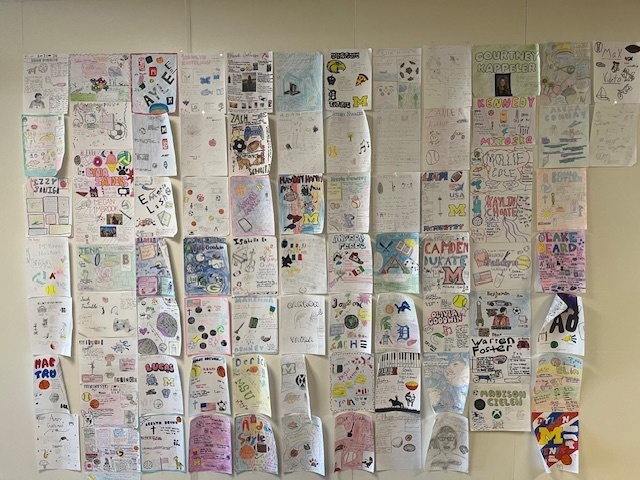 One pager student project displayed on the wall