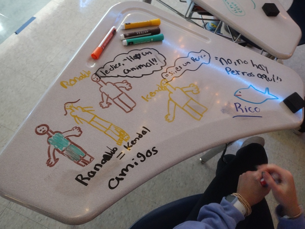 Spanish 2 and 3 students work on a desk 