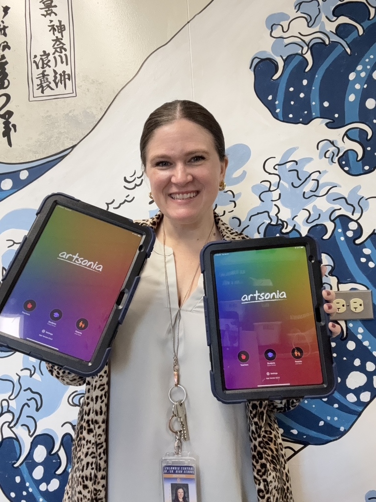 Teacher holding two iPads