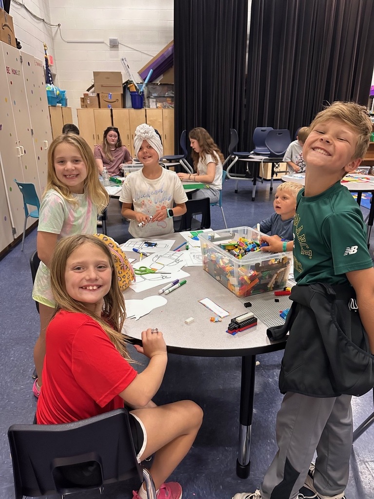 students building with legos