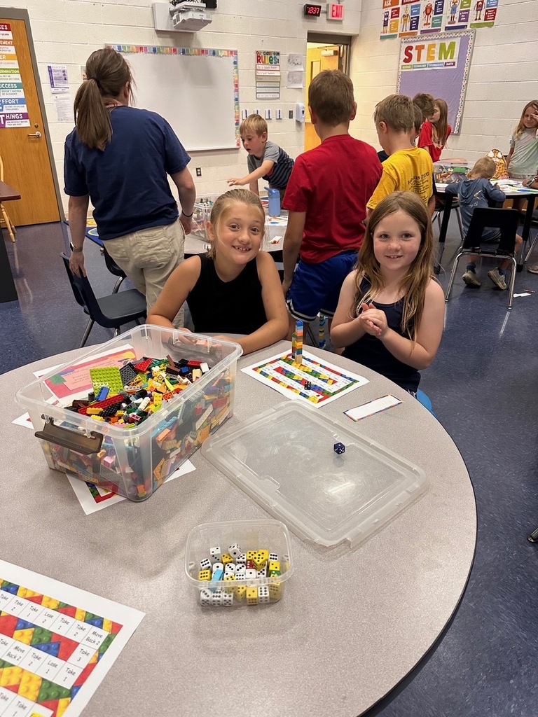 girls building at lego camp