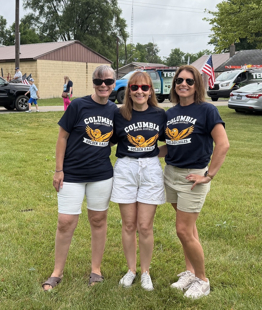 Three staff ready to walk in the parade