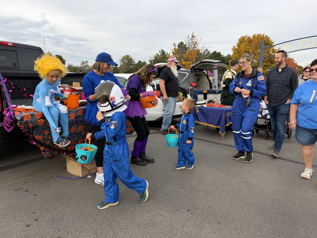 Elementary staff passing out candy to astronauts