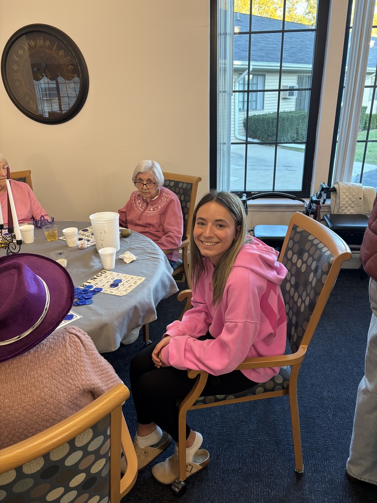 Leadership student playing bingo with the seniors