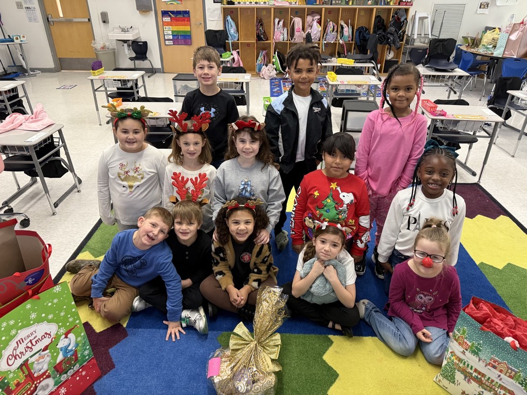 WCS students displaying some of the gifts they collected for the nursing home residents.