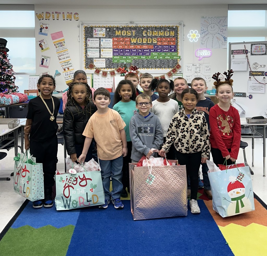 WCS students displaying some of the gifts they collected for the nursing home residents.