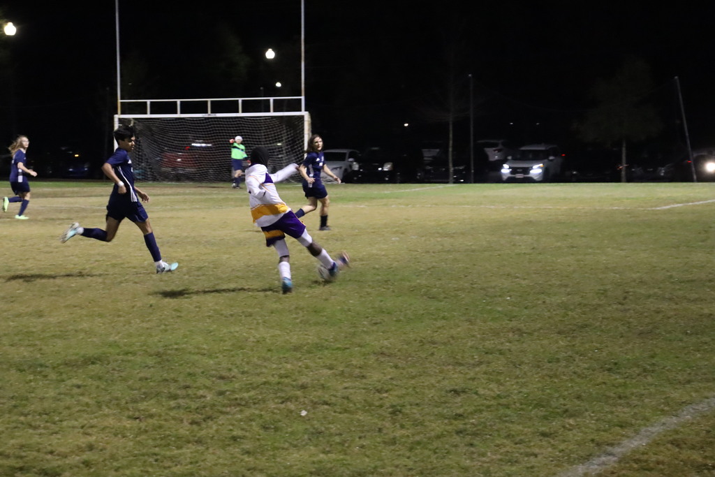 Falcons soccer player kicks the ball