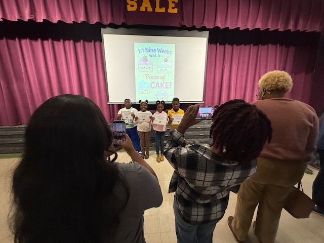 Family take pictures of Sale Elementary  scholars. 