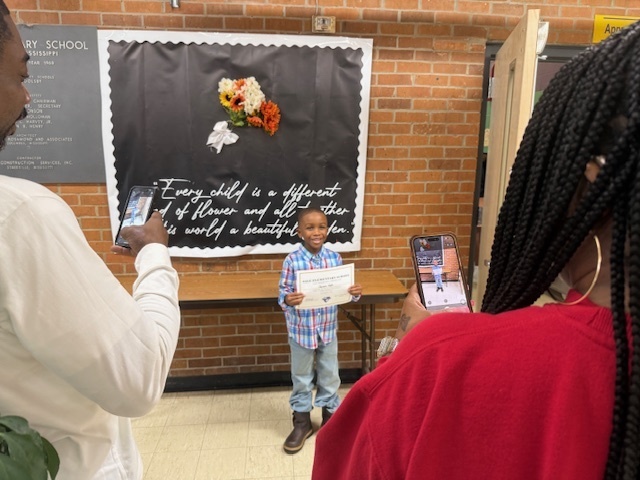 Parents celebrate good grades with their student