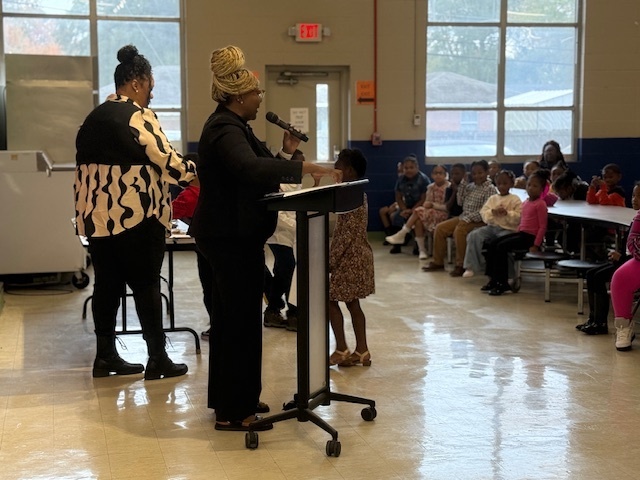 Sale Elementary administrators give out awards to students.