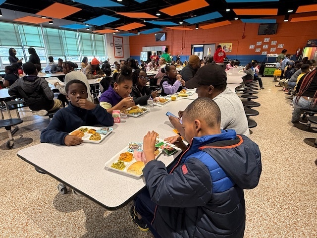 Cook Elementary students enjoy a Thanksgiving lunch.