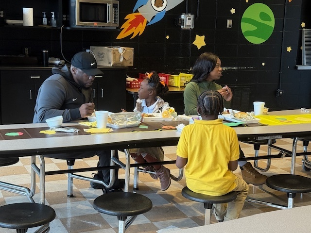 Fairview students enjoy a meal with their parents. 