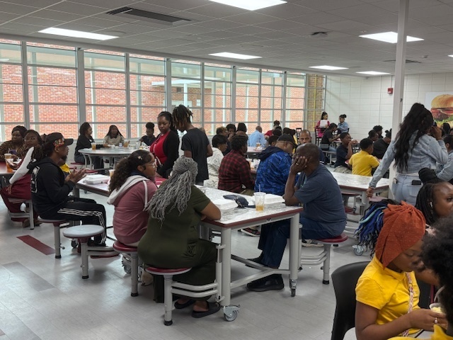 Students and parents at Hunt Intermediate enjoy a Thanksgiving meal on Wednesday.