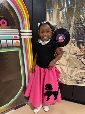 Sale Elementary student has fun at a sock hop.