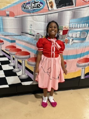 Sale Elementary student prepares to have fun at a sock hop.