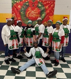 CHS Child Nutrition staff strike up a funny pose and showoff their holiday spirit.  