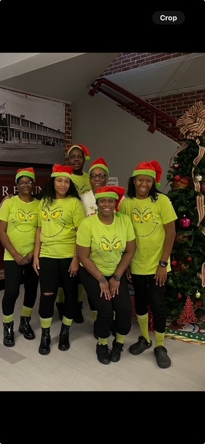 Hunt Intermediate Child Nutrition staff show their "Grinch" wear.