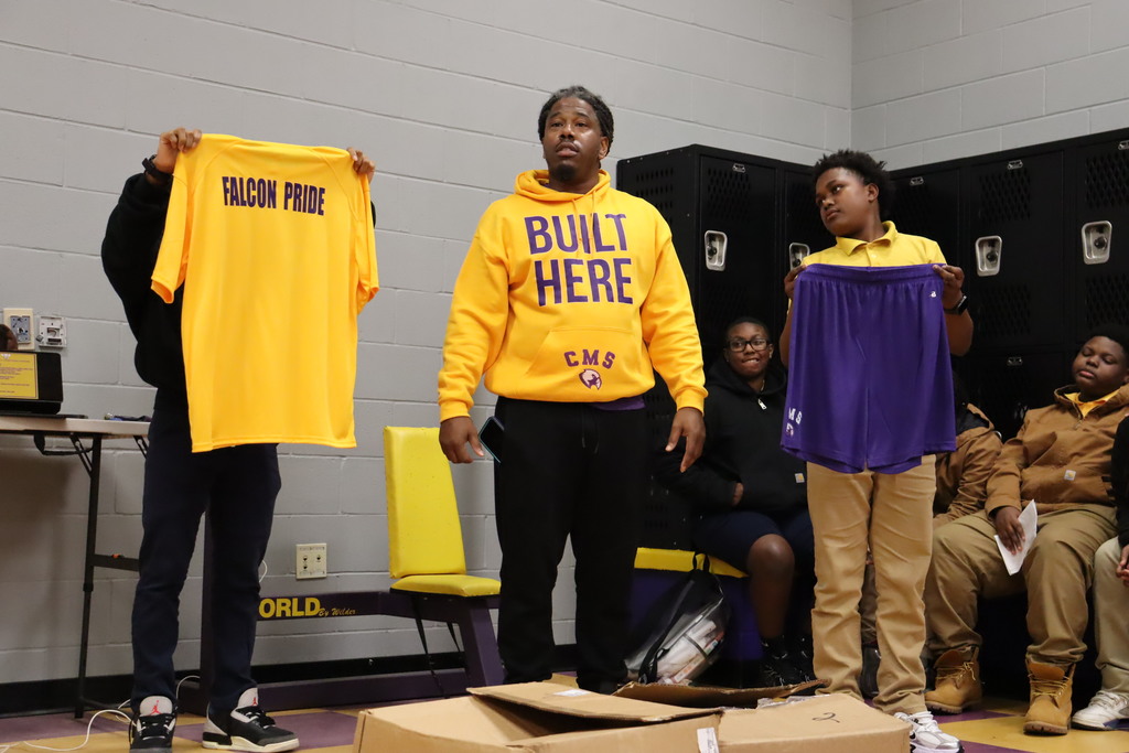 CMS football players receive jerseys. 