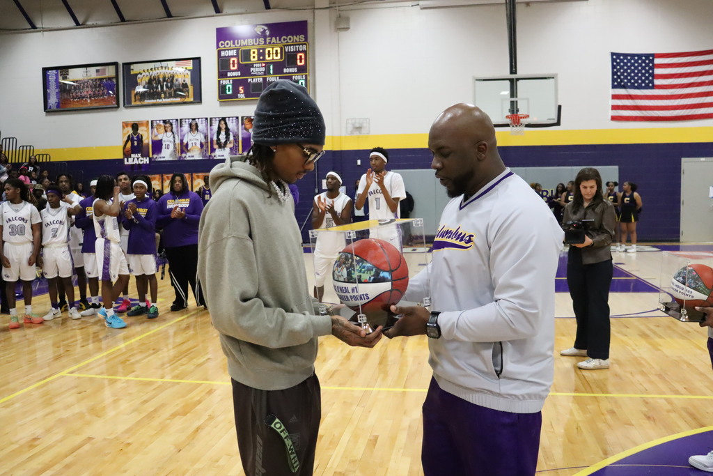 Jace O'Neal is honored for scoring 1,000 points during his Columbus High basketball career.