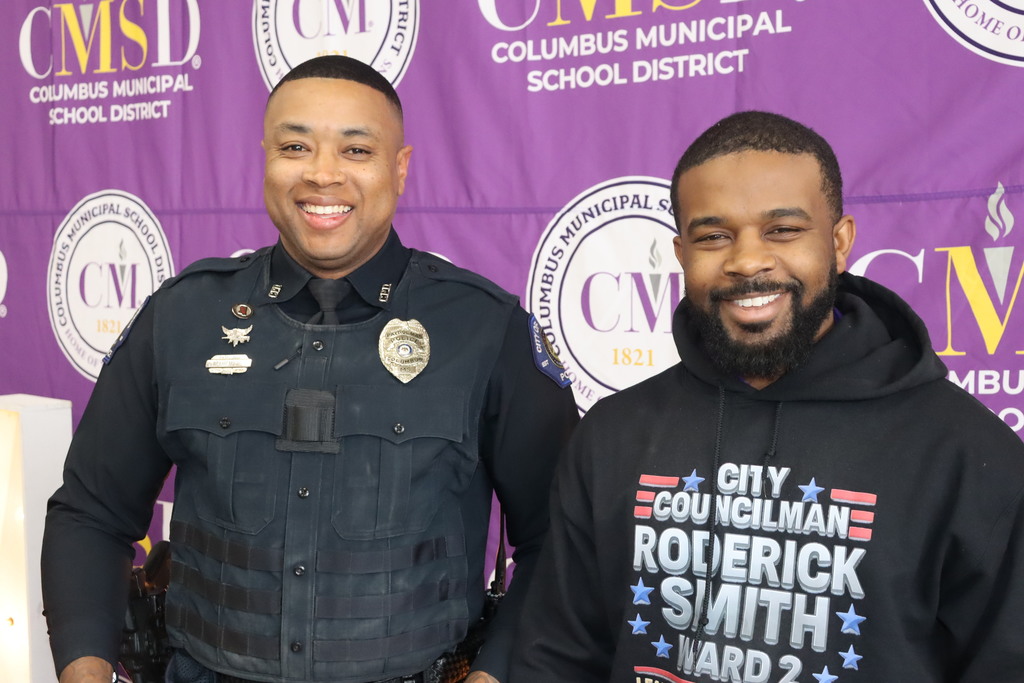Councilman Roderick Smith and Officer Bryan Moore judged the booths set up by the schools at the CMSD Career Fair