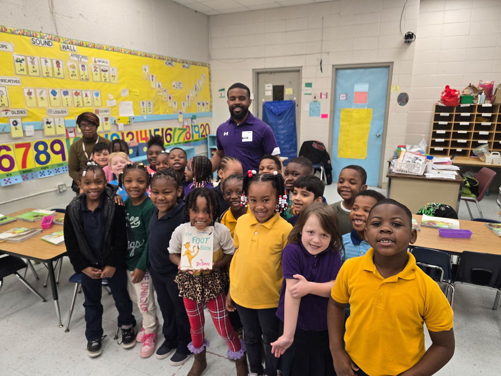 Cook students pose for a picture after City Councilman Roderick Smith read to the class.