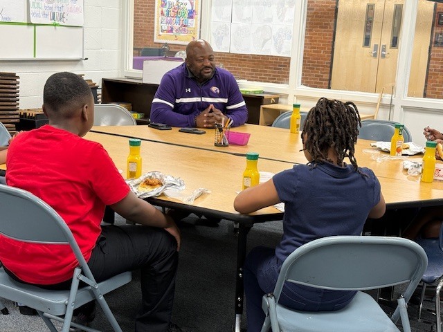 Sale students talk with Mr. Chapman. 