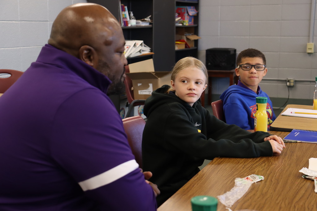 Cook Elementary  students talk with Mr. Chapman. 