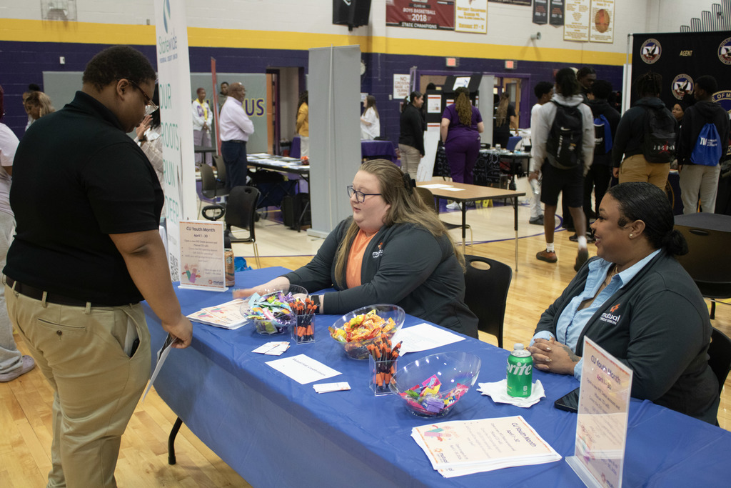 CHS student talks with business representatives at the school's recent career fair.